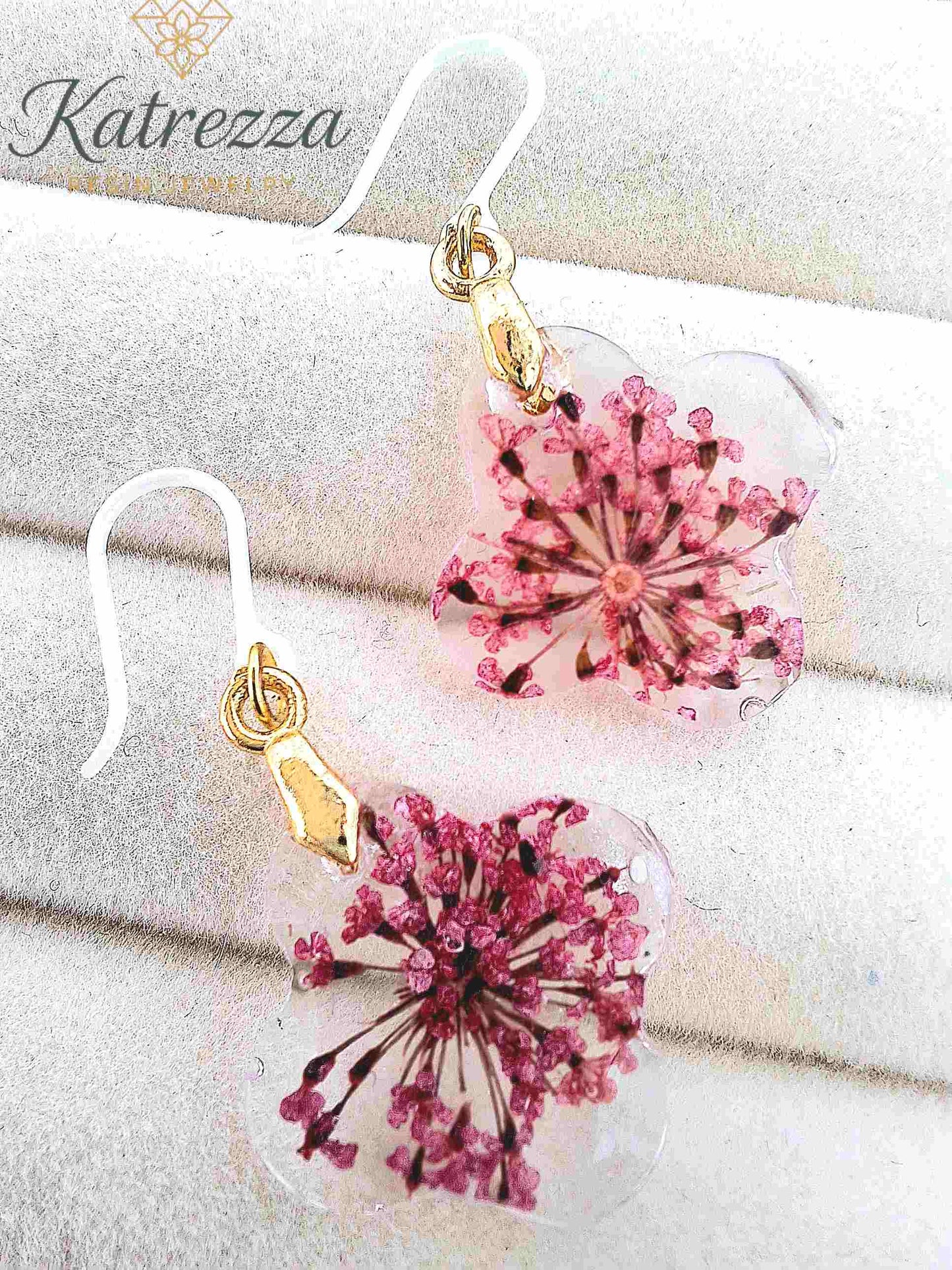 Close-up of hypoallergenic resin earrings with silicone hooks