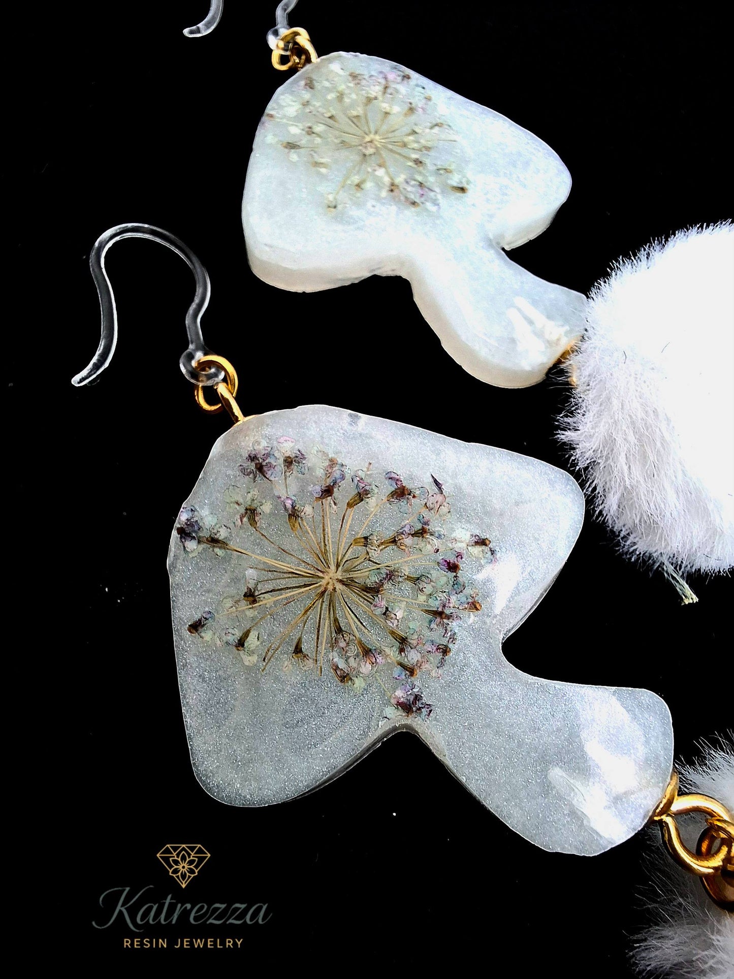 “Detailed close-up of double-sided mushroom resin earrings, showing real Queen Anne’s lace flowers preserved in resin with hypoallergenic hooks.”