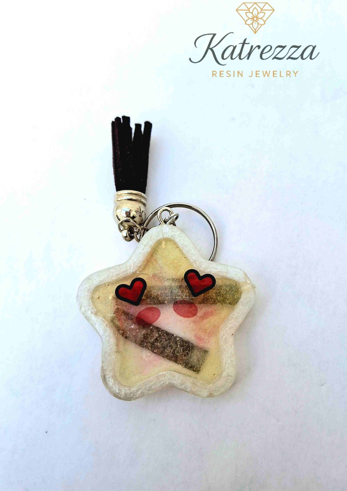 “Resin star keychain with I’m Here For You and Keep It Real text and heart design.”