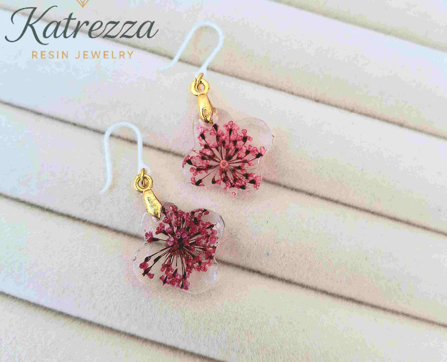 Handmade floral resin earrings with preserved pink flowers