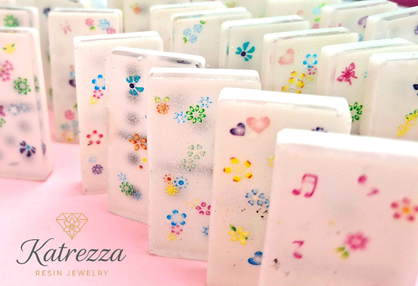 Decorative resin dominoes with colorful embedded flowers