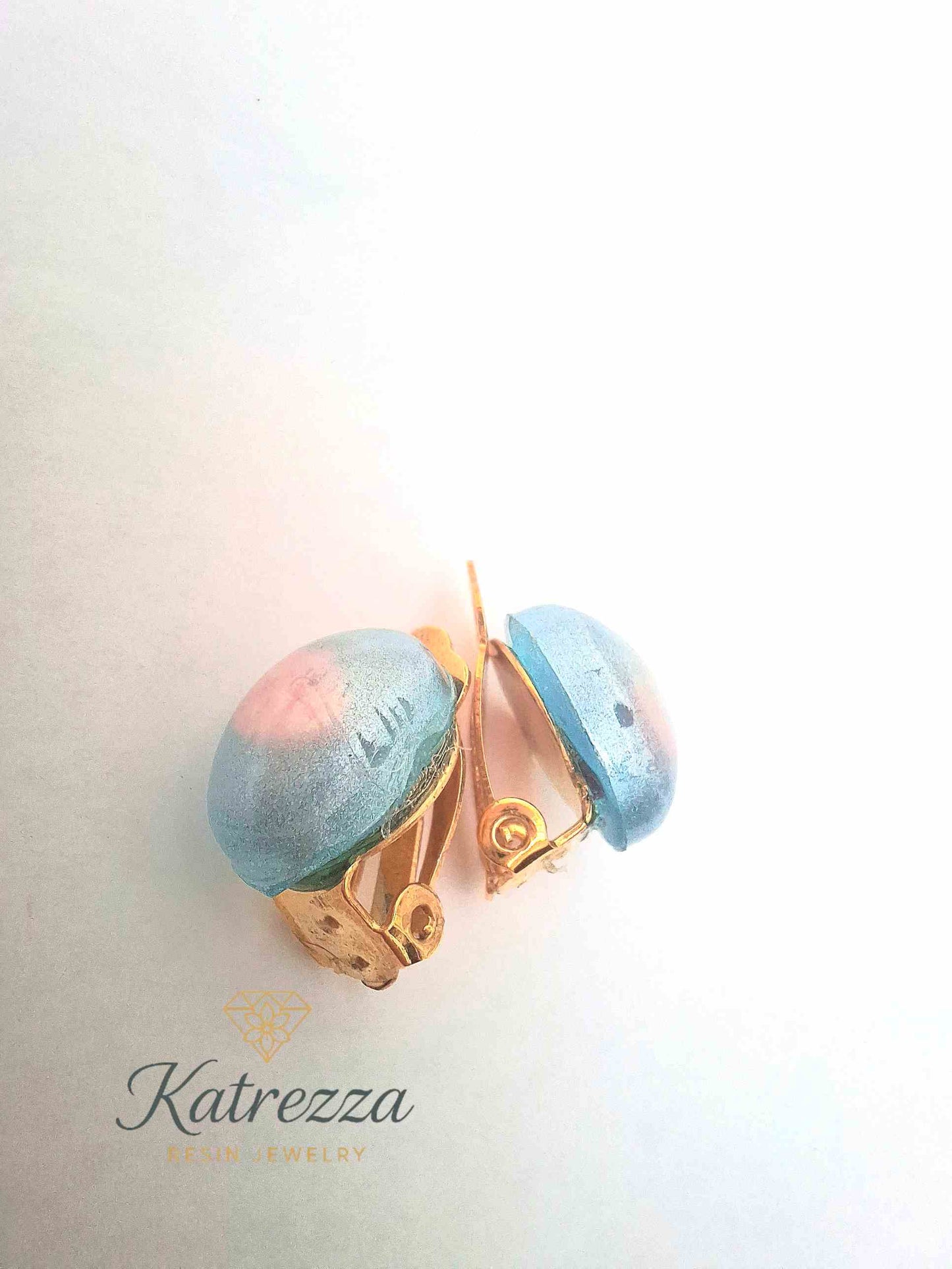 “Children’s resin clip-on earrings in shimmering blue and pink – lightweight play jewellery