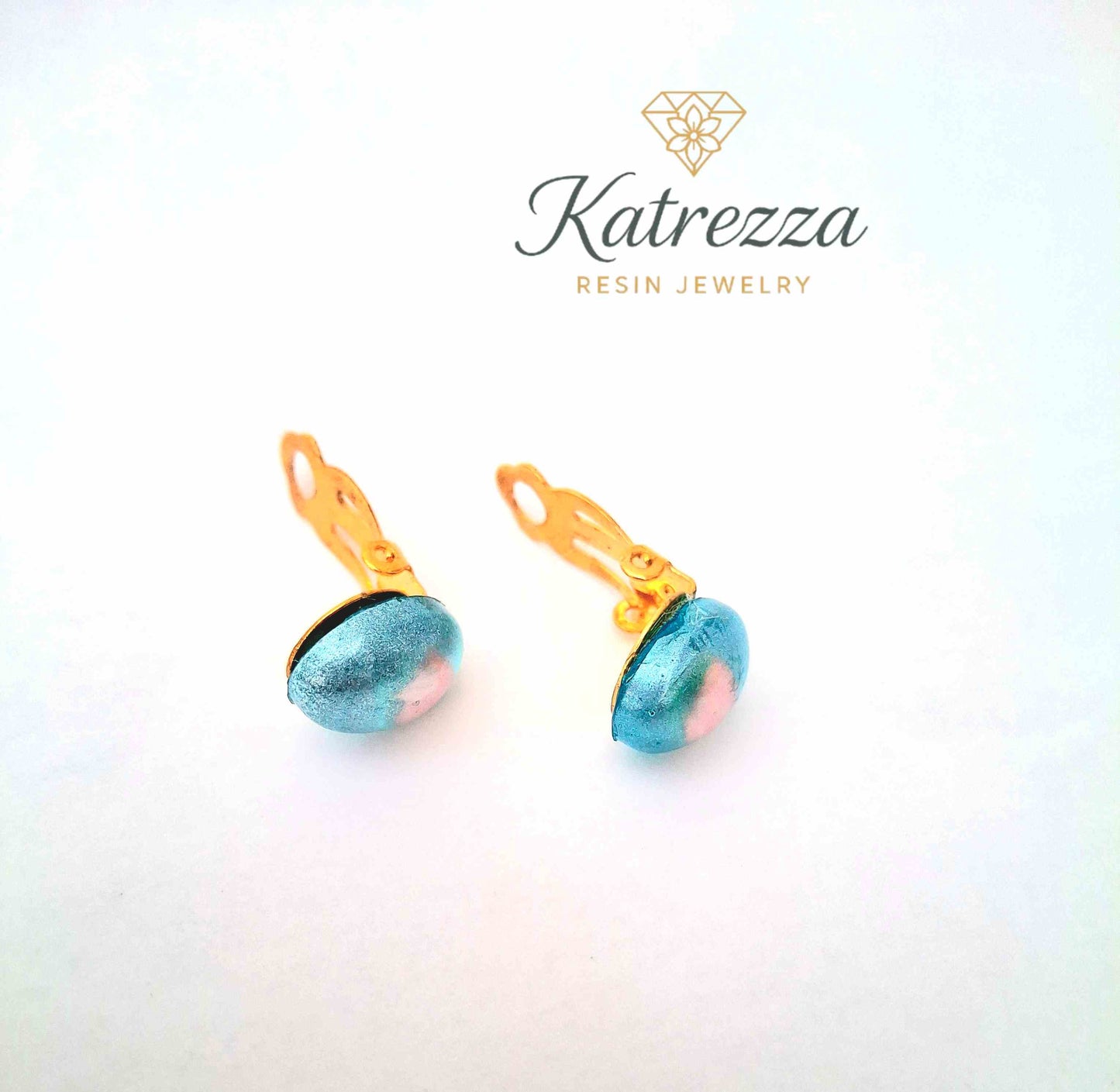“Handmade kids resin clip-on earrings in metallic blue with pink center – Katrezza jewellery.”