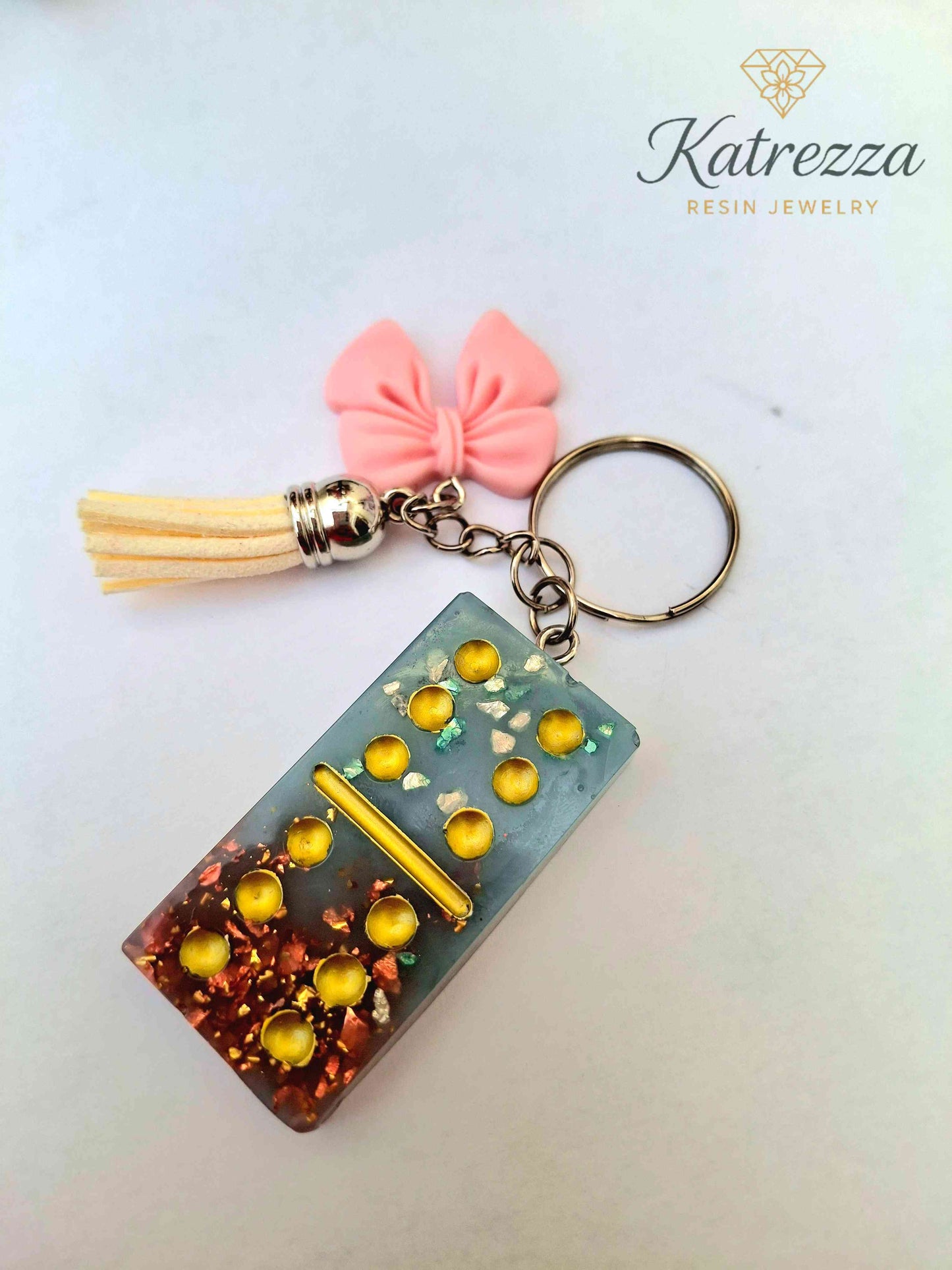 Handmade Resin Domino Keychain – Glitter & Gold Flakes with Tassel and Bow Charm