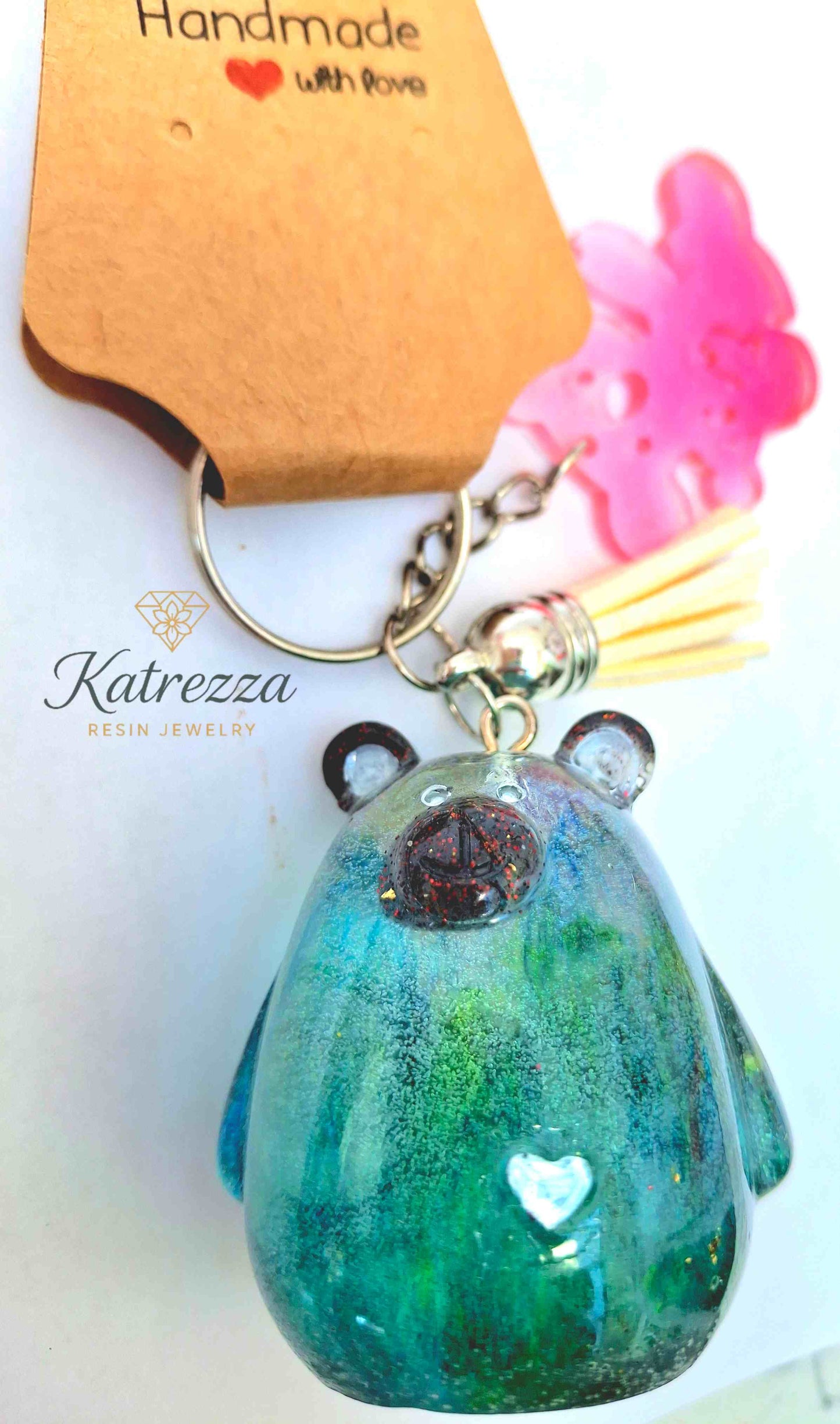 “Handmade resin teddy bear keychain in green with heart detail – Imperfects Collection”
