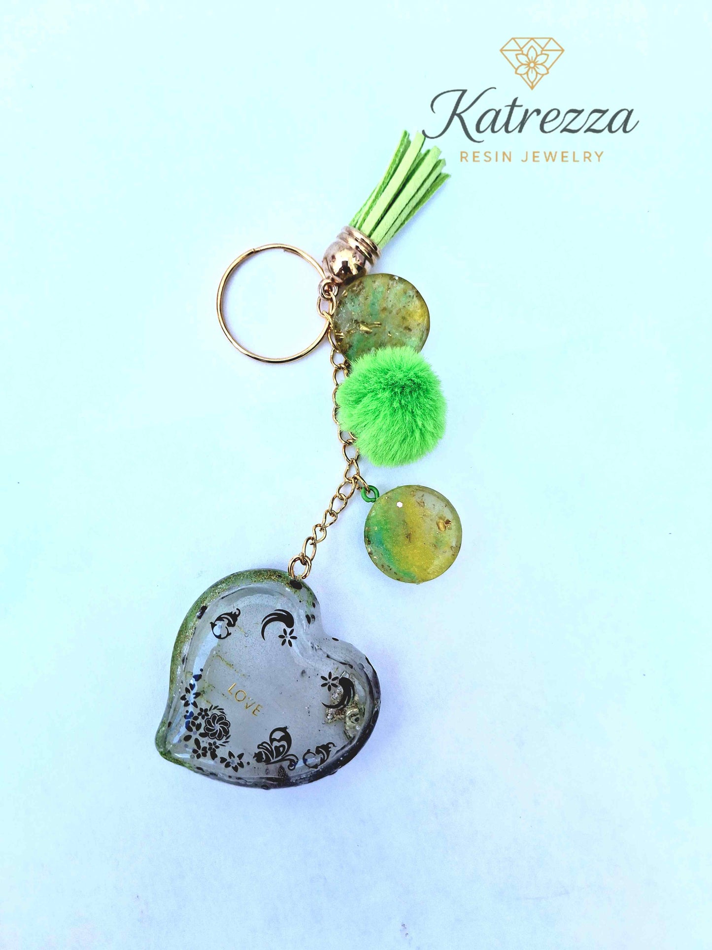 Handmade resin heart keychain with tassel, green pom, and gold-flake resin discs – Katrezza Jewelry