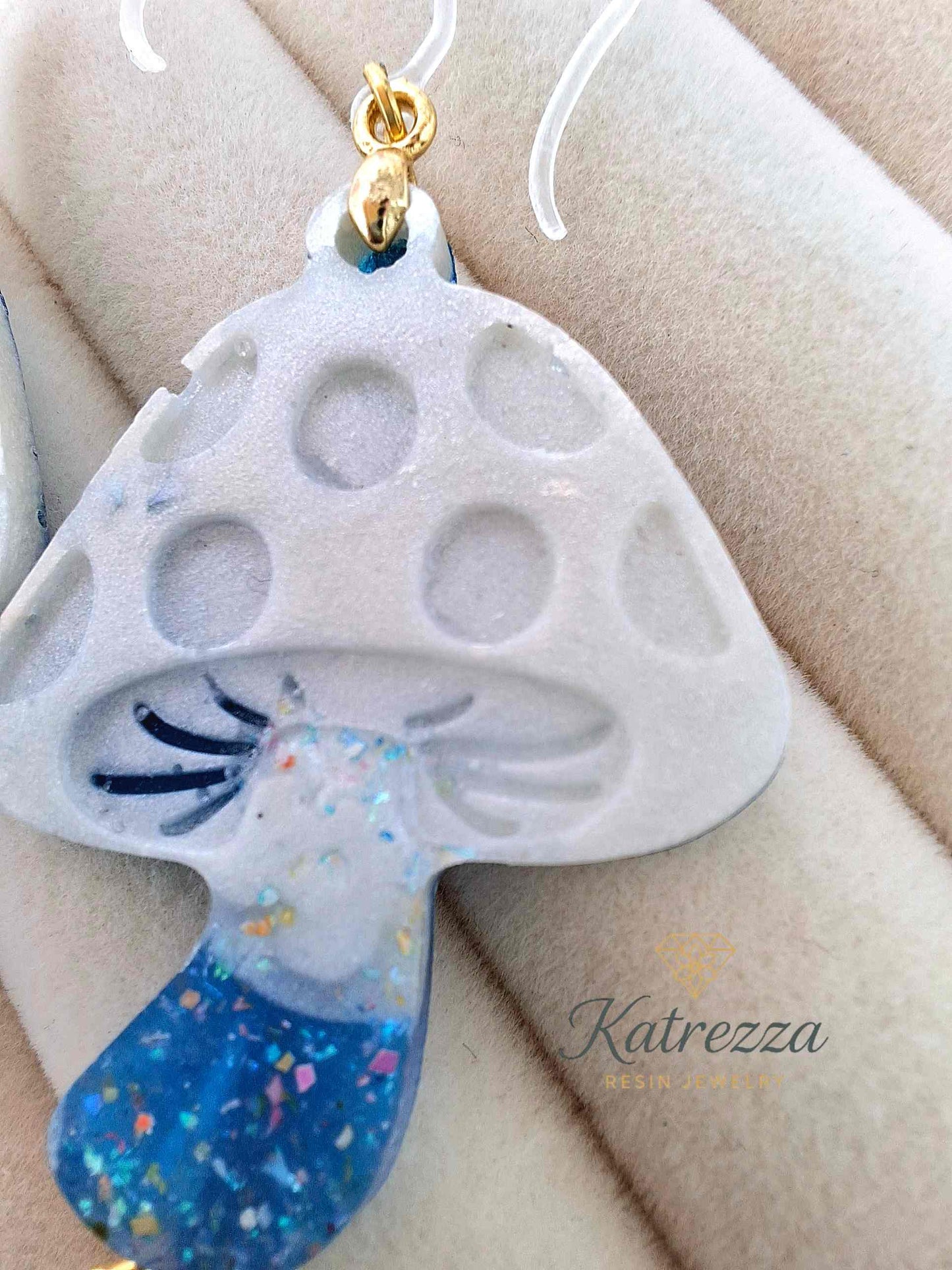 "Double-sided handmade resin mushroom earring with white glitter cap, blue glitter stem, and hypoallergenic hook – Katrezza Jewelry