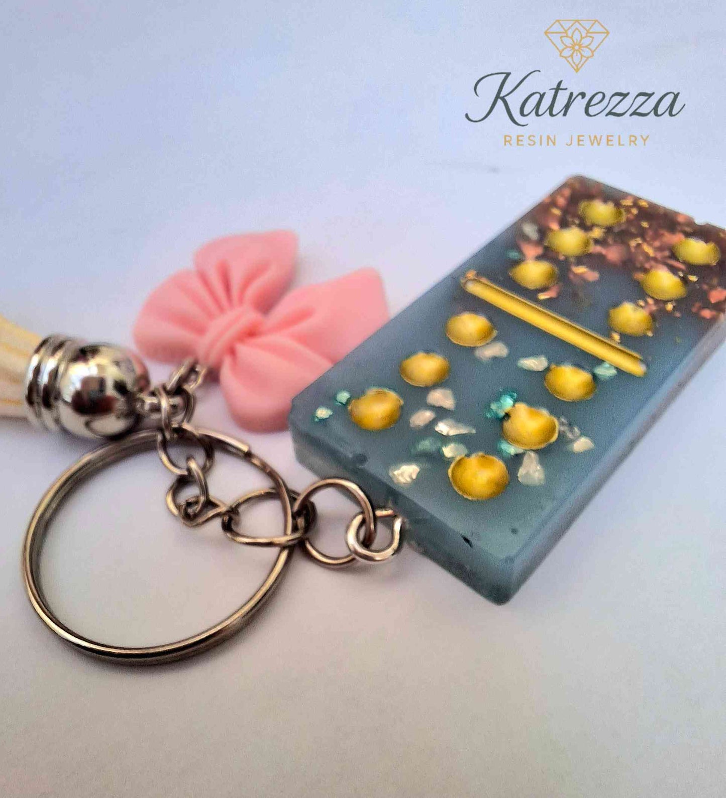 Handmade Resin Domino Keychain – Glitter & Gold Flakes with Tassel and Bow Charm