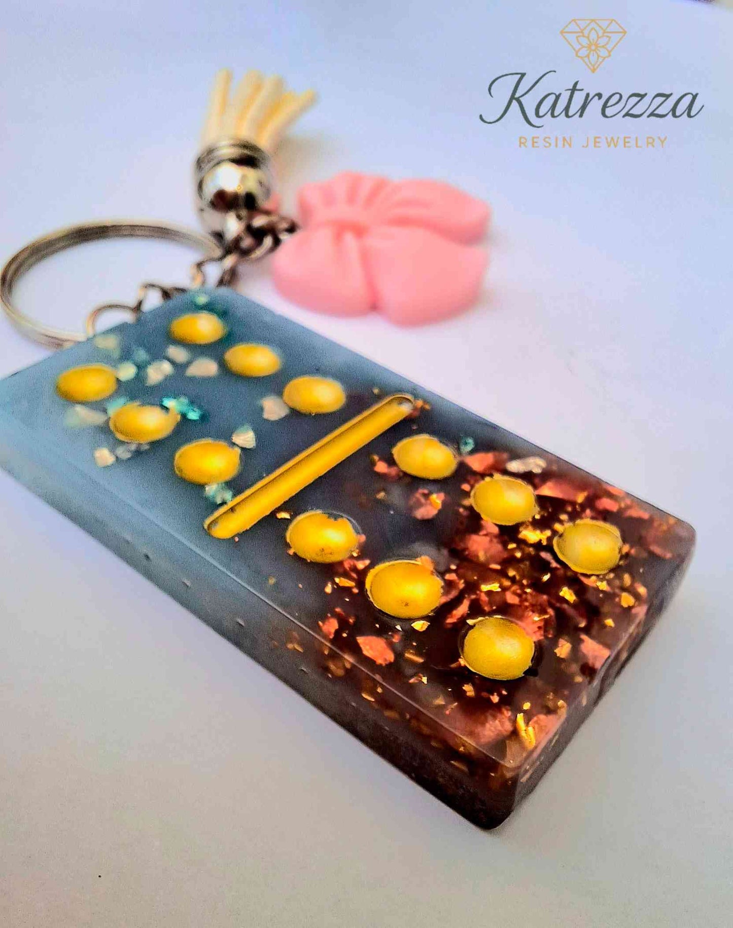Handmade Resin Domino Keychain – Glitter & Gold Flakes with Tassel and Bow Charm