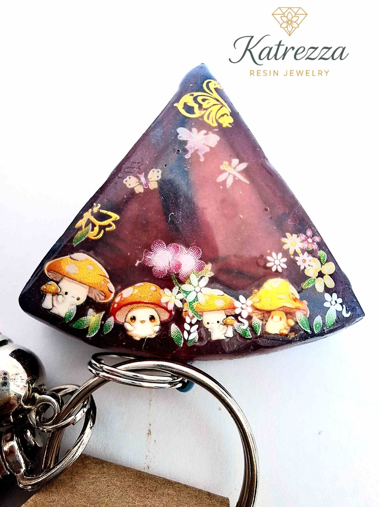 "Whimsical resin slice keychain with mushrooms, butterflies and flowers"