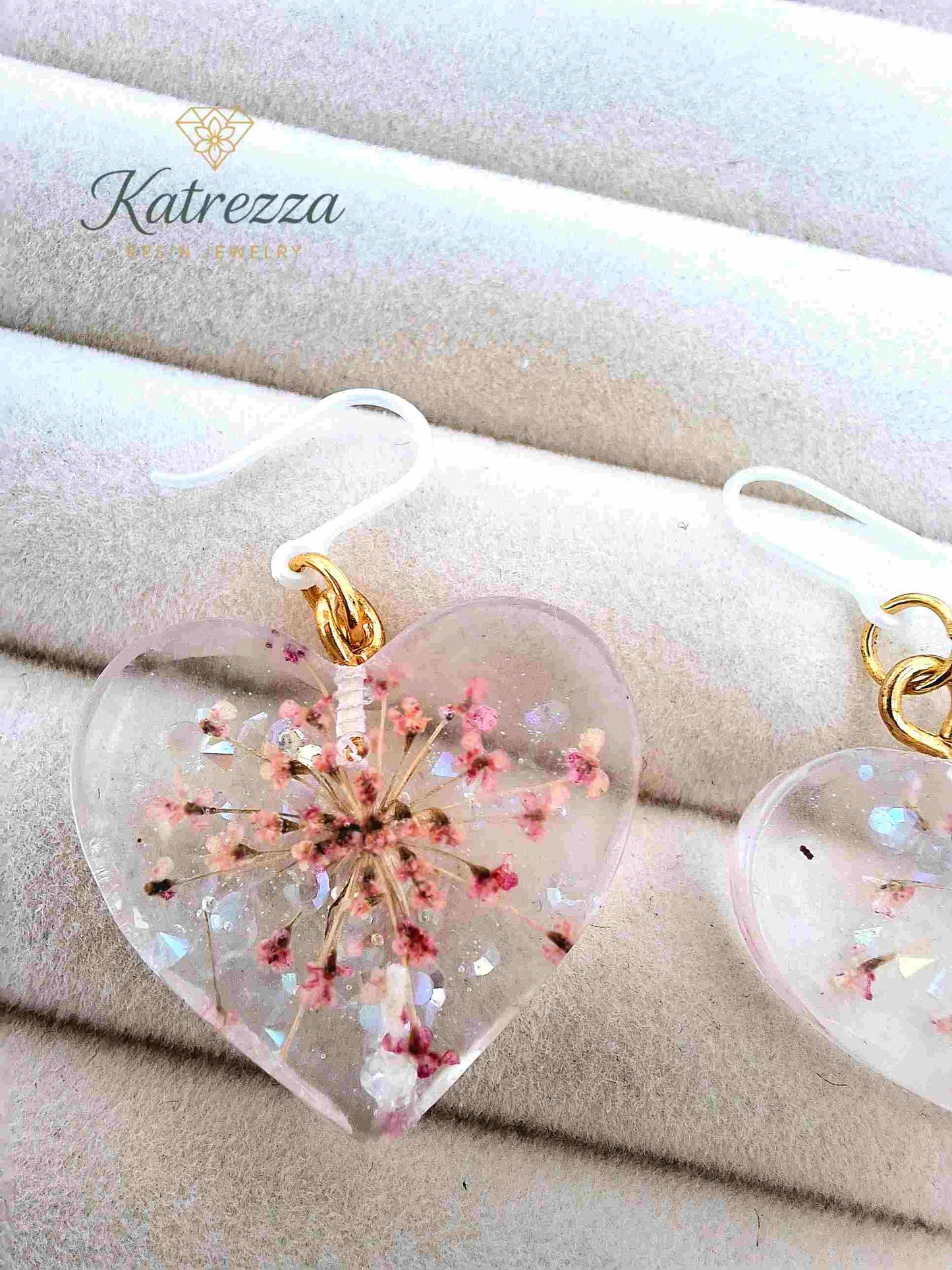 Transparent heart resin earrings with real pink flowers and sparkles