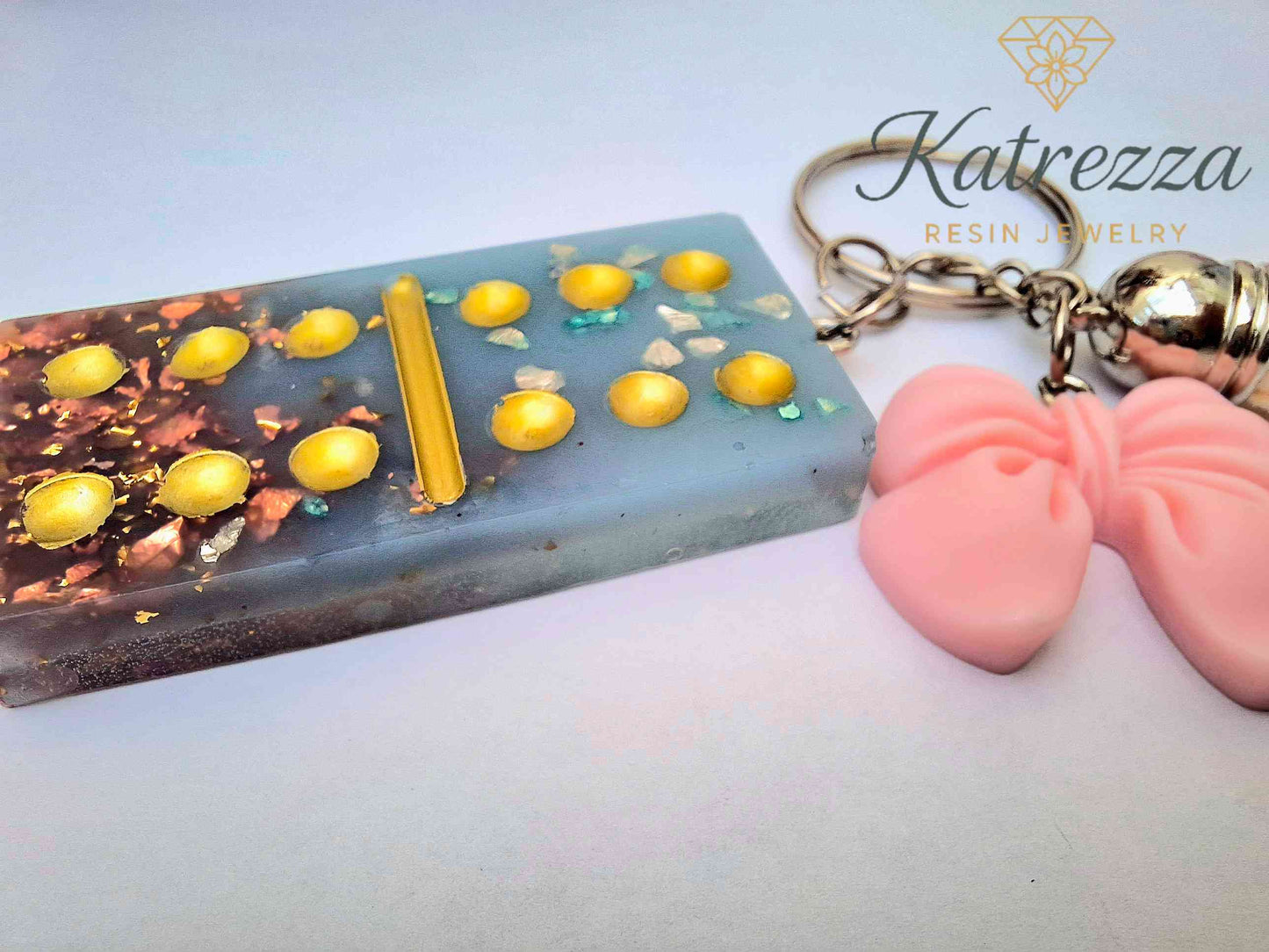 Handmade Resin Domino Keychain – Glitter & Gold Flakes with Tassel and Bow Charm