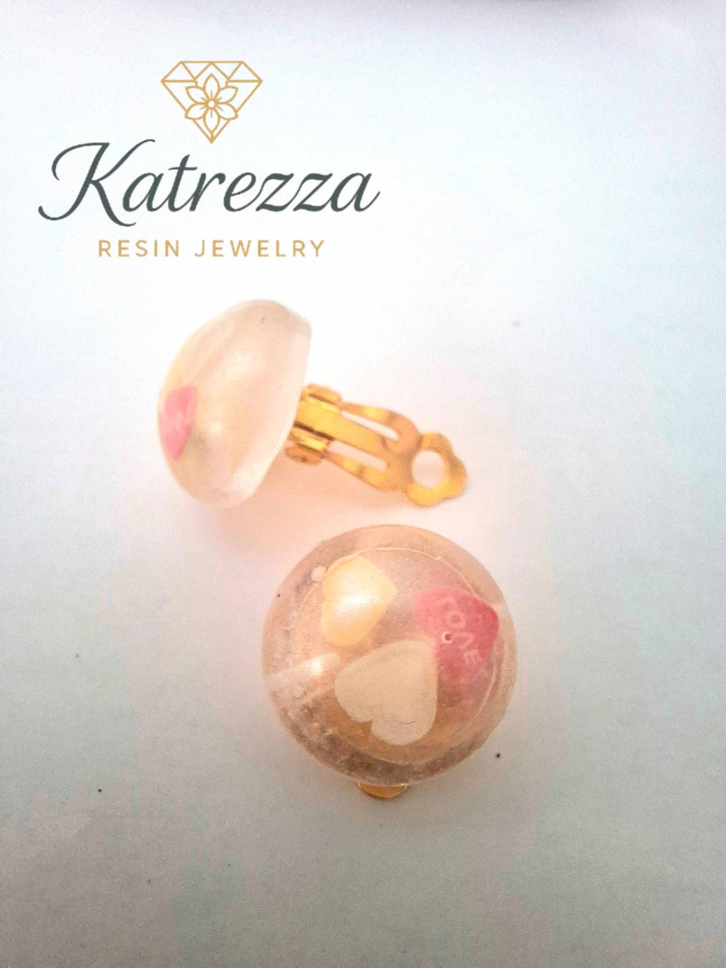 “Children’s resin clip-on earrings with gold clips – playful handmade design.”