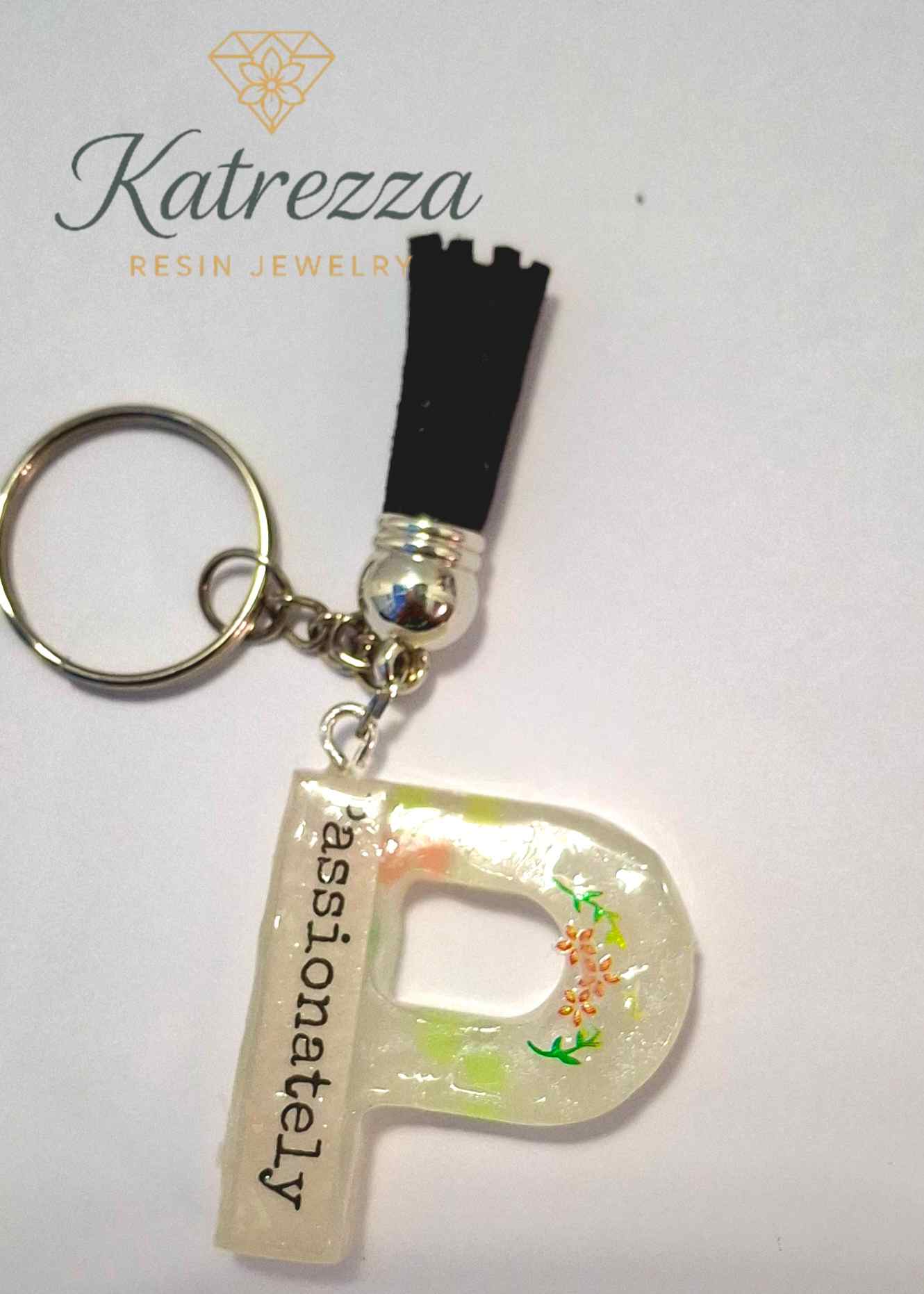 Handmade resin P keychain with tassel, Katrezza jewelry branding.