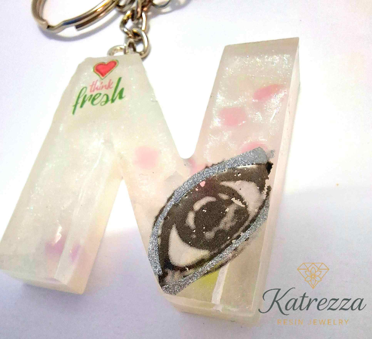 Handmade resin N keychain with tassel, Katrezza branding.