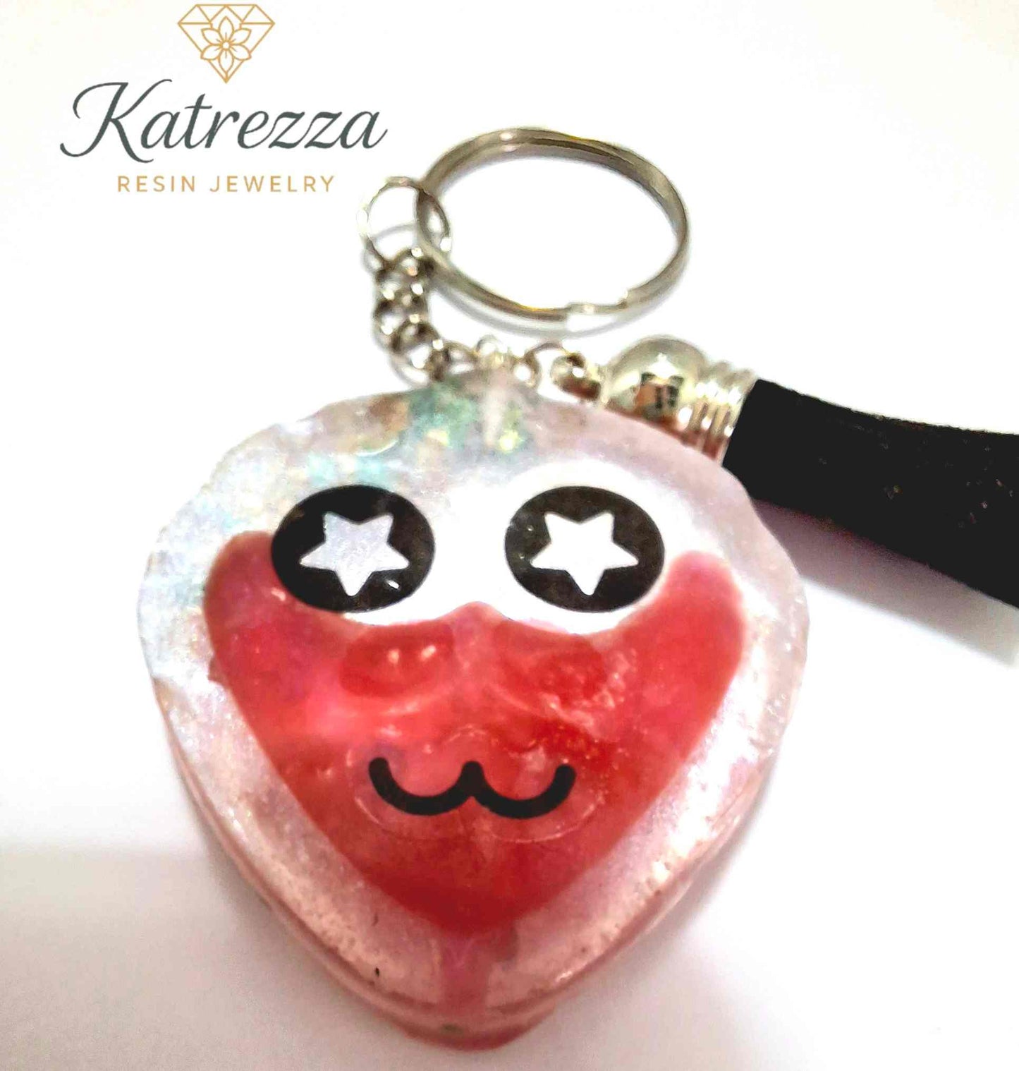 Close-up of handmade resin keychain with glitter accents, pink smiley face, and “SO SWEET” label – The Imperfects Collection, Katrezza.