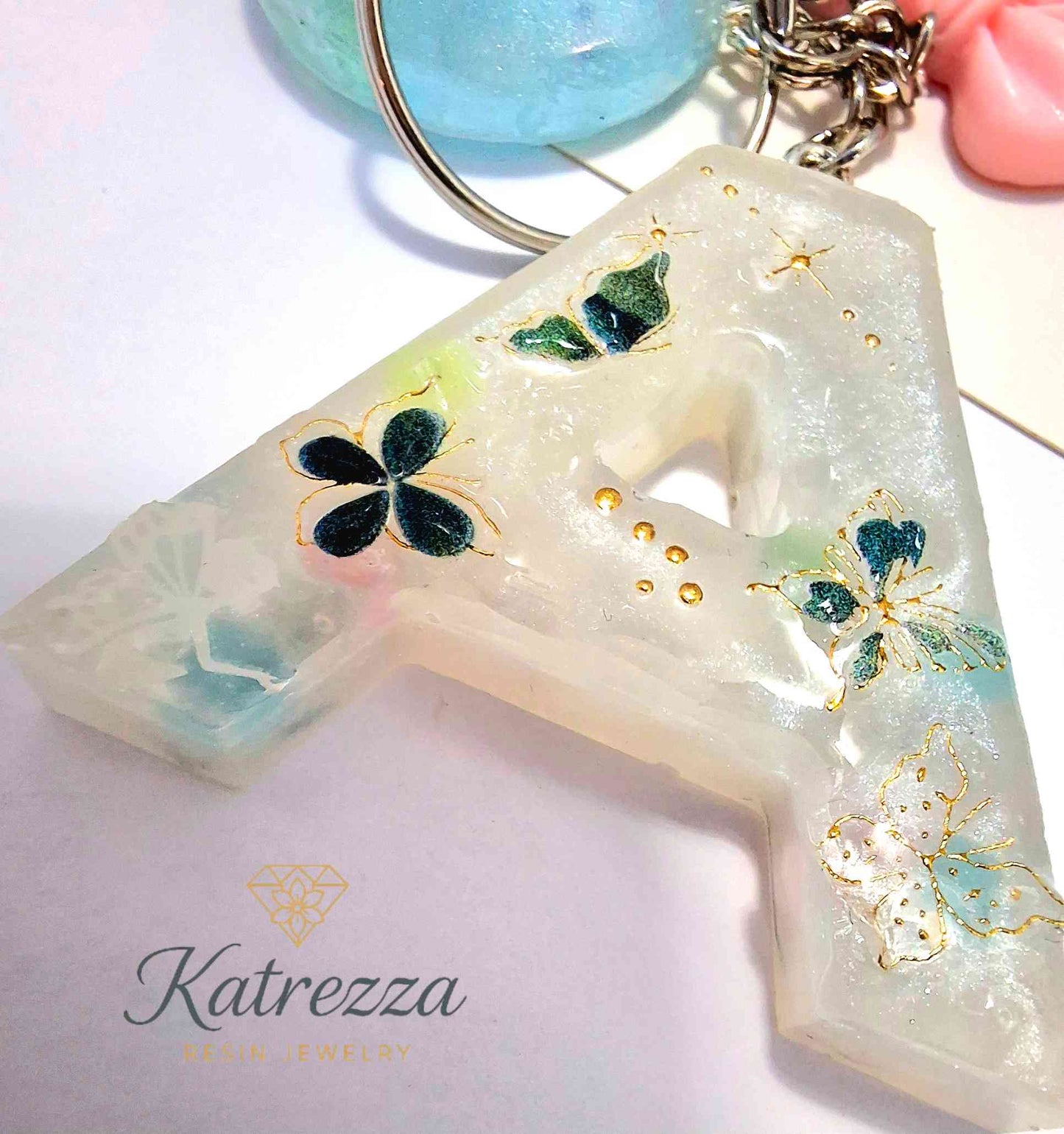 Resin A keychain gift set with decorative bow and tassel, Katrezza jewelry.
