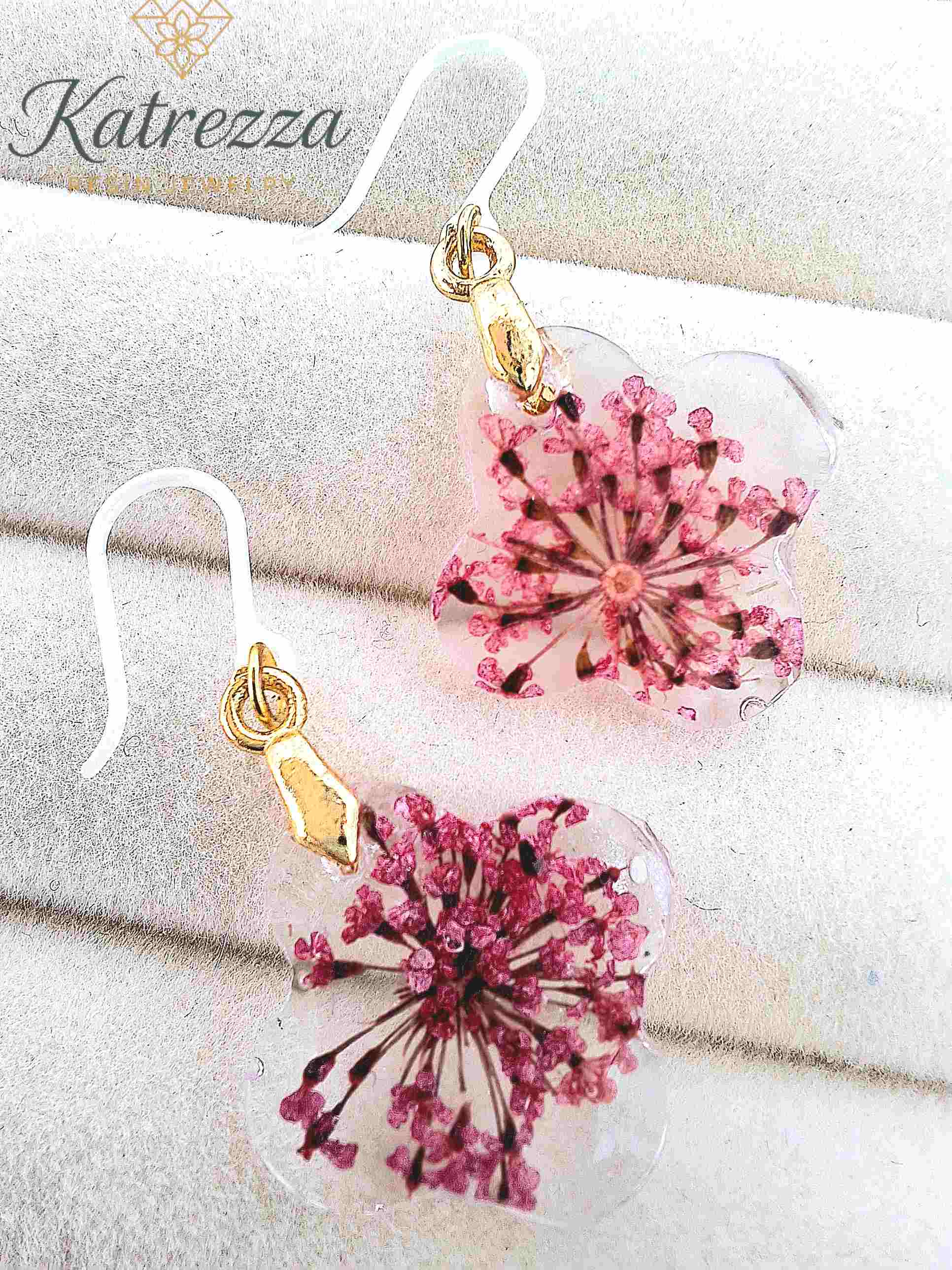 Close-up of hypoallergenic resin earrings with silicone hooks
