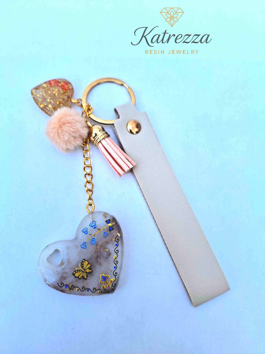 "Luxurious resin heart keychain with golden butterflies, gold flakes, pink tassel and pompom – Katrezza Jewelry"
