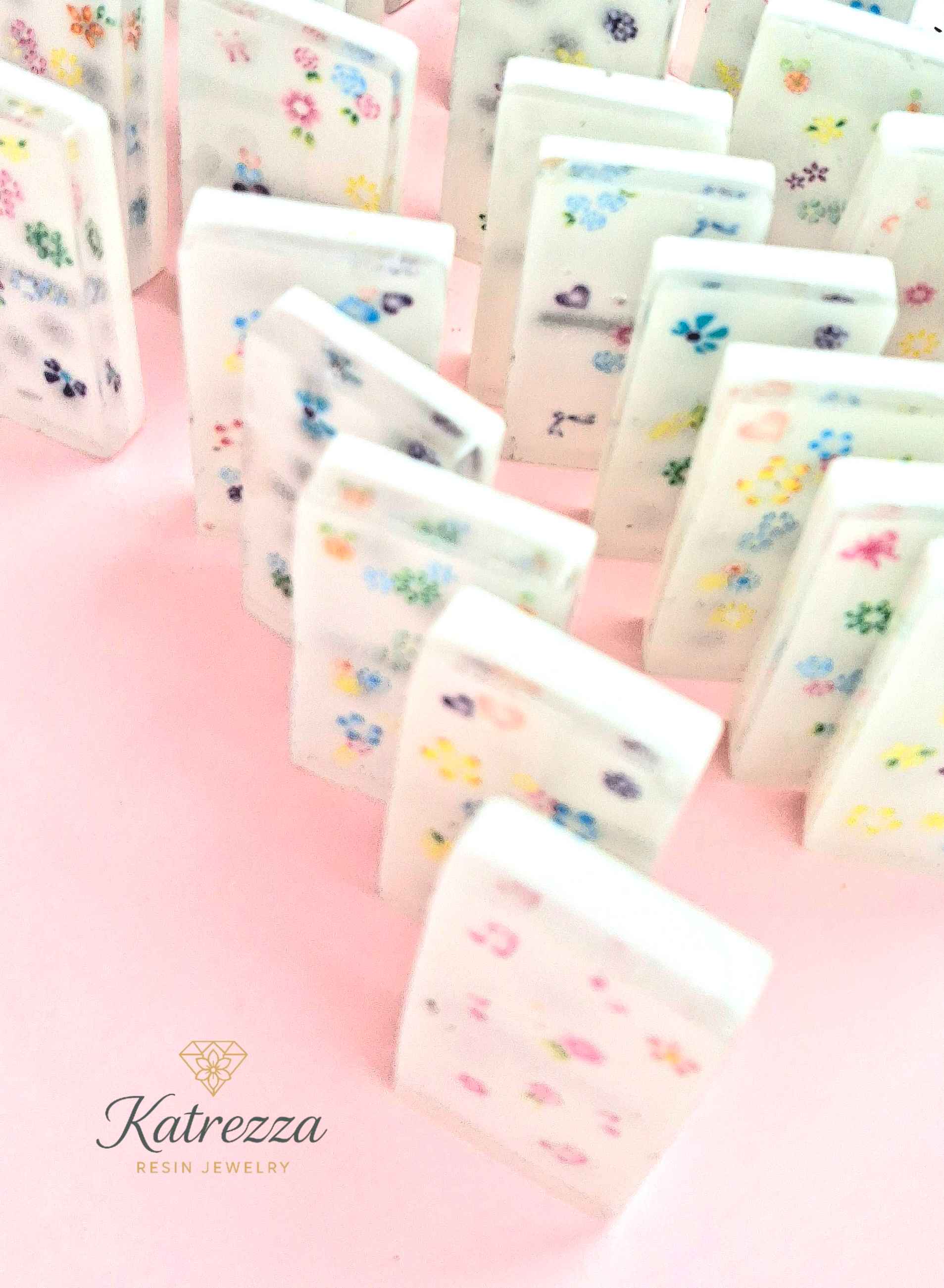 Close-up of classic resin domino with black dots
