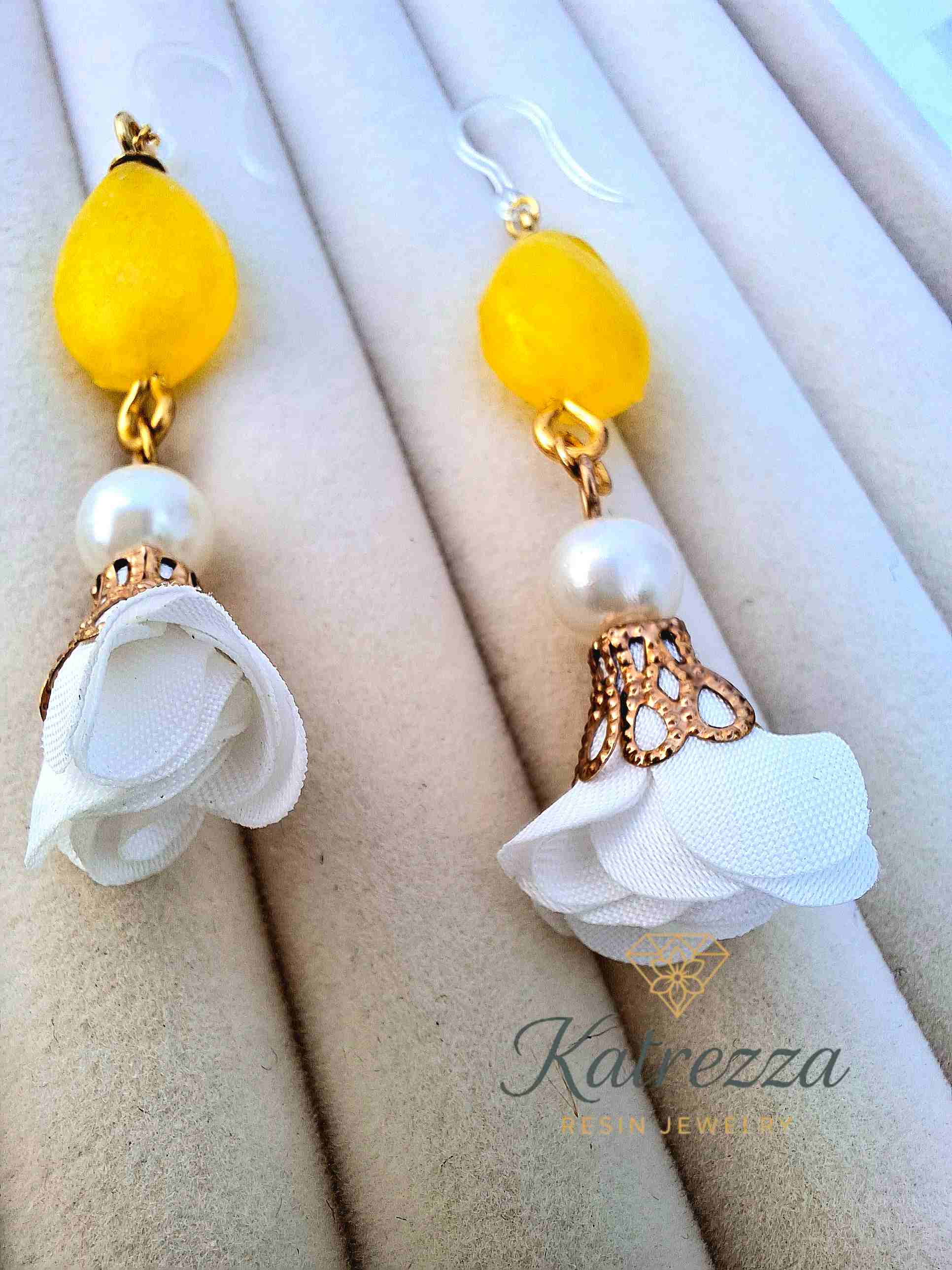"Handmade yellow resin drop earrings featuring pearls and white flower charms with gold details – Katrezza Jewelry"