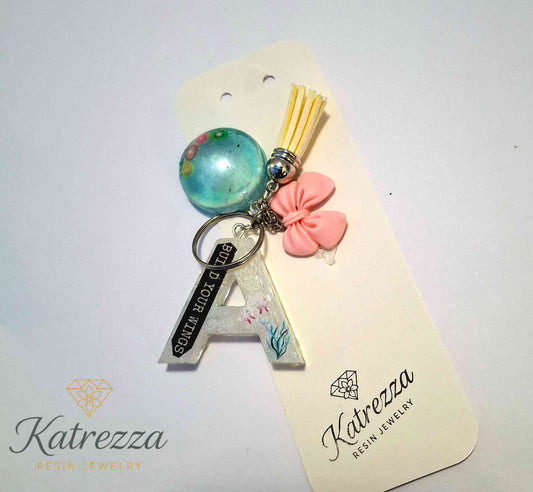 Resin letter A keychain with “Build Your Wings” quote and floral stickers