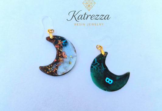 “Double-sided resin crescent moon earrings showing reverse side with teal shimmer and hypoallergenic silicone hooks – Katrezza jewelry.”