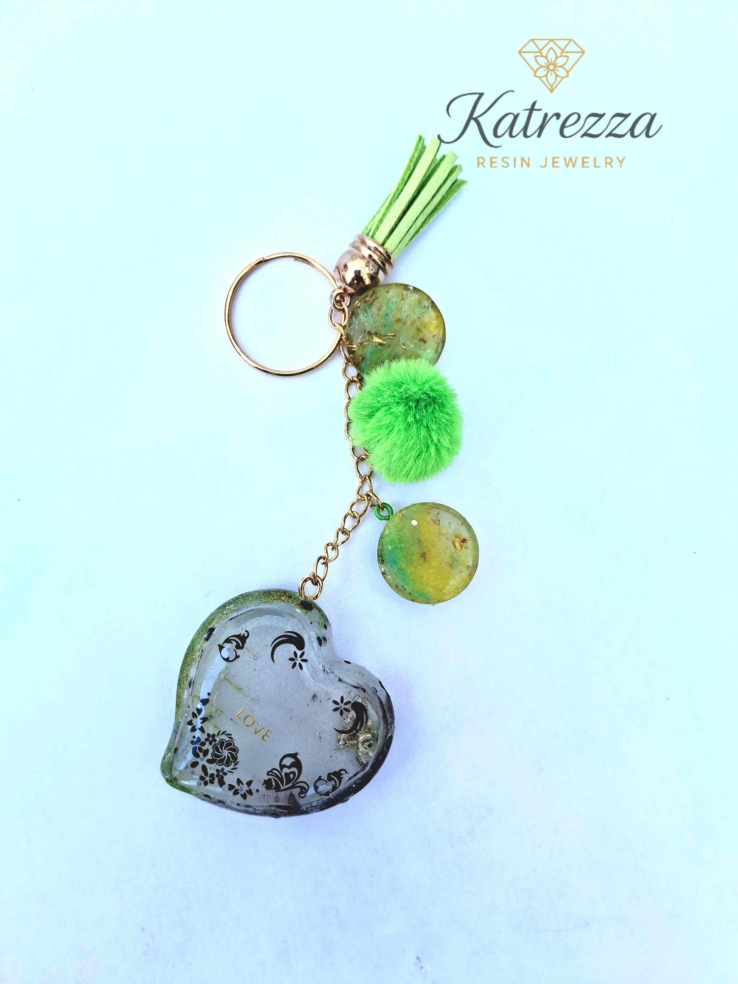 Handmade resin heart keychain with tassel, green pom, and gold-flake resin discs – Katrezza Jewelry

