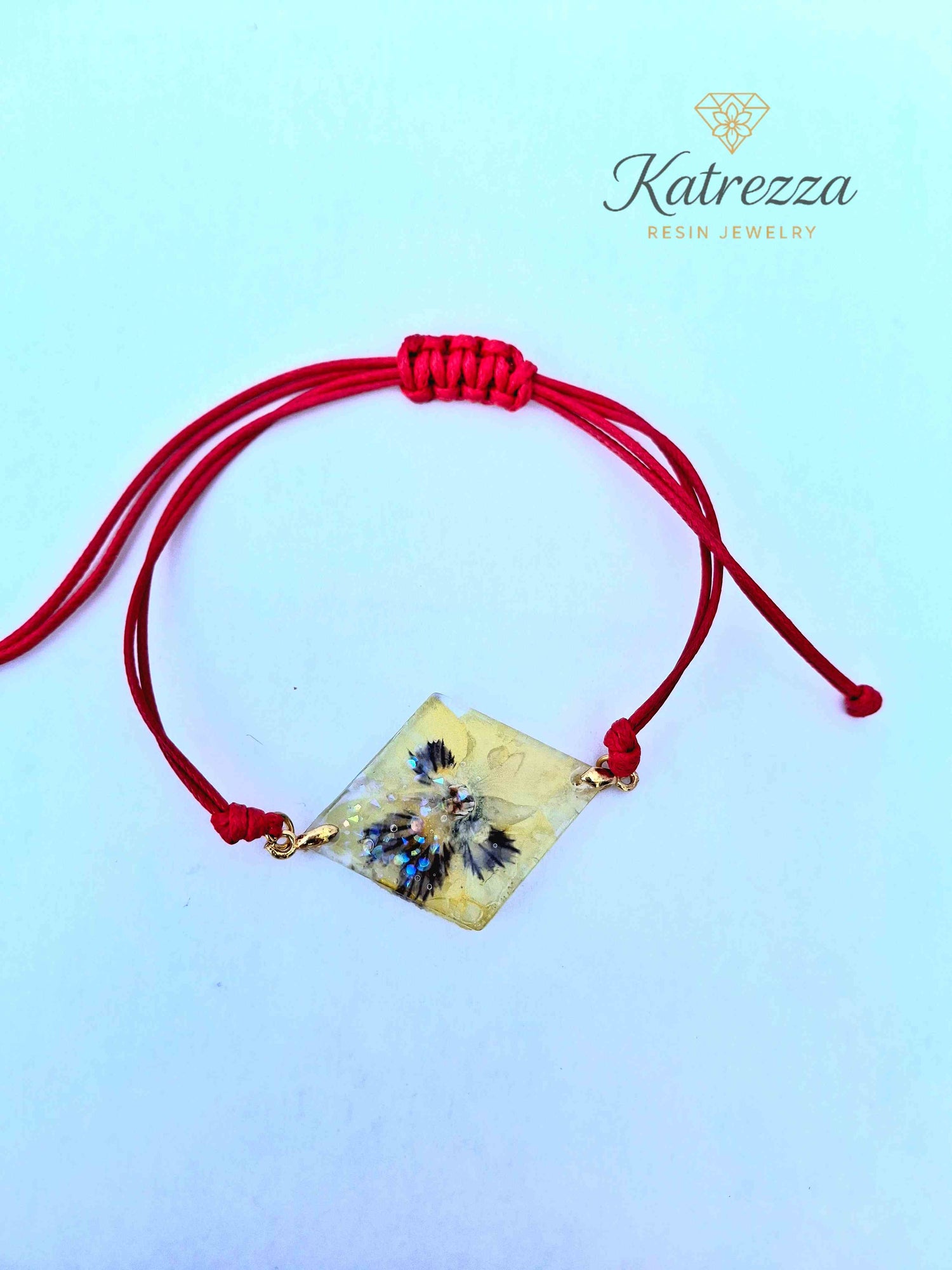 Handmade diamond resin bracelet with real pansy flower inside.