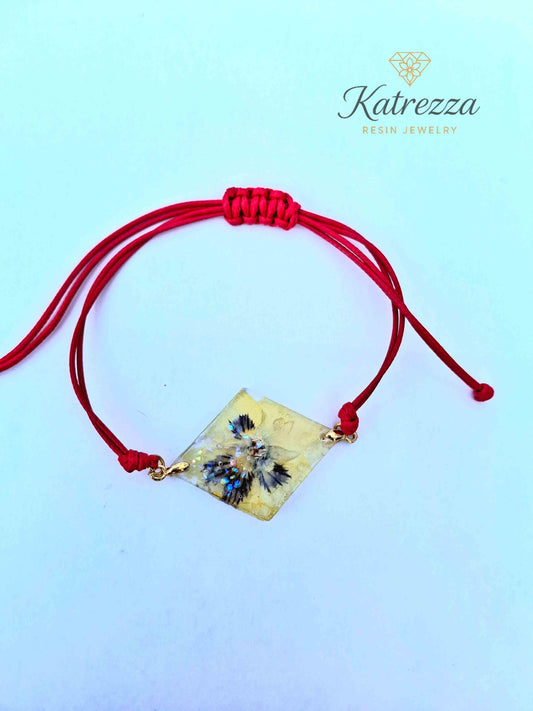 Handmade diamond resin bracelet with real pansy flower inside.