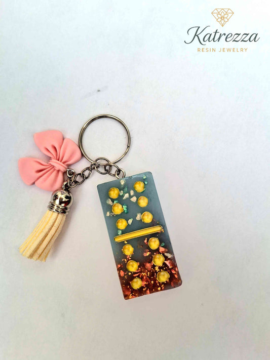 Handmade Resin Domino Keychain – Glitter & Gold Flakes with Tassel and Bow Charm