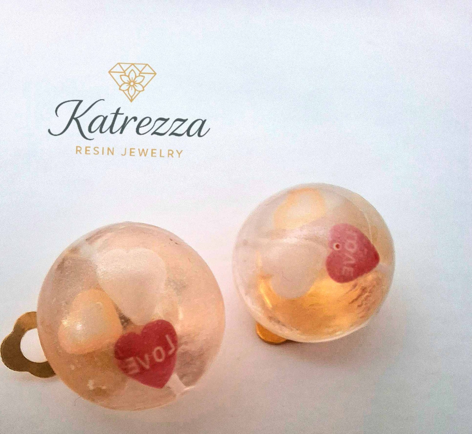 Kids resin clip-on earring with red heart and white heart details – Katrezza jewellery.”