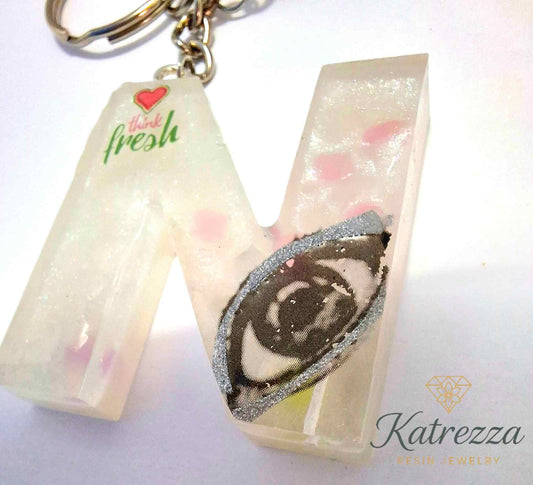 Handmade resin N keychain with tassel, Katrezza branding.