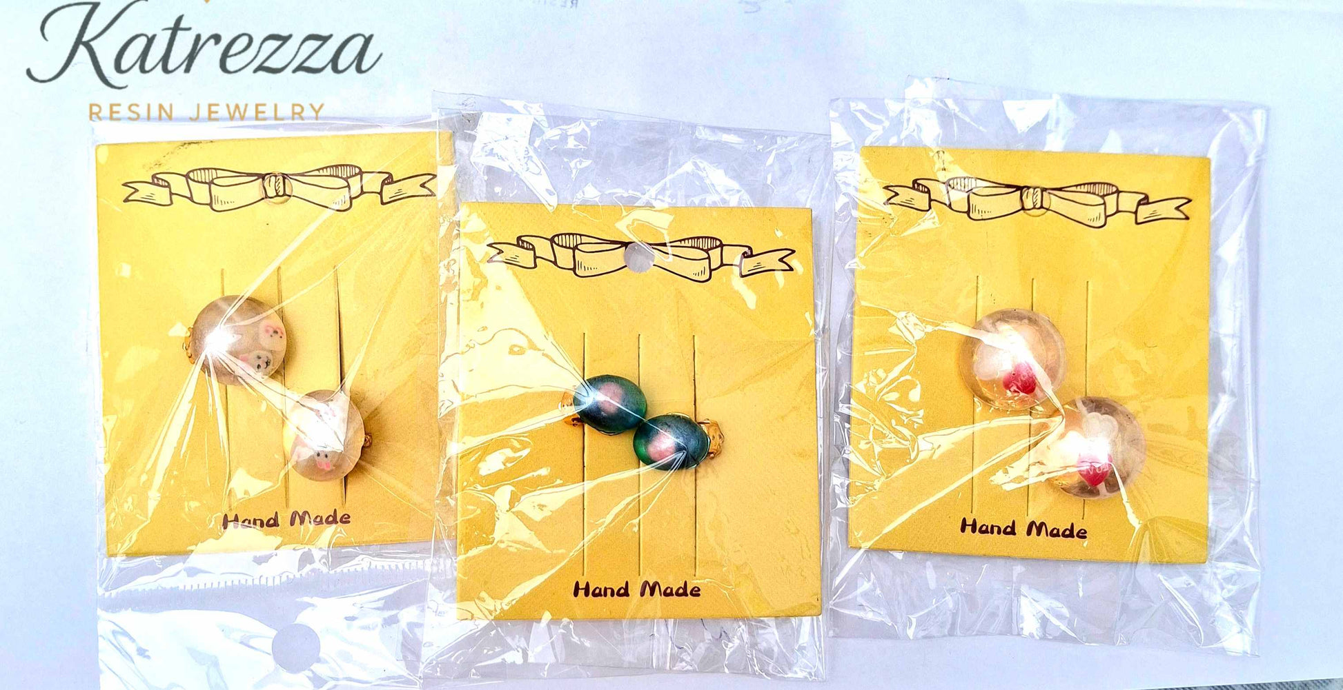 “Set of handmade resin clip-on earrings for girls – blue with pink design, safe play jewellery.”
