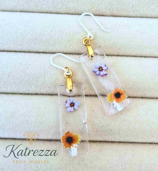Girls’ handmade resin earrings with sunflower & purple flowers